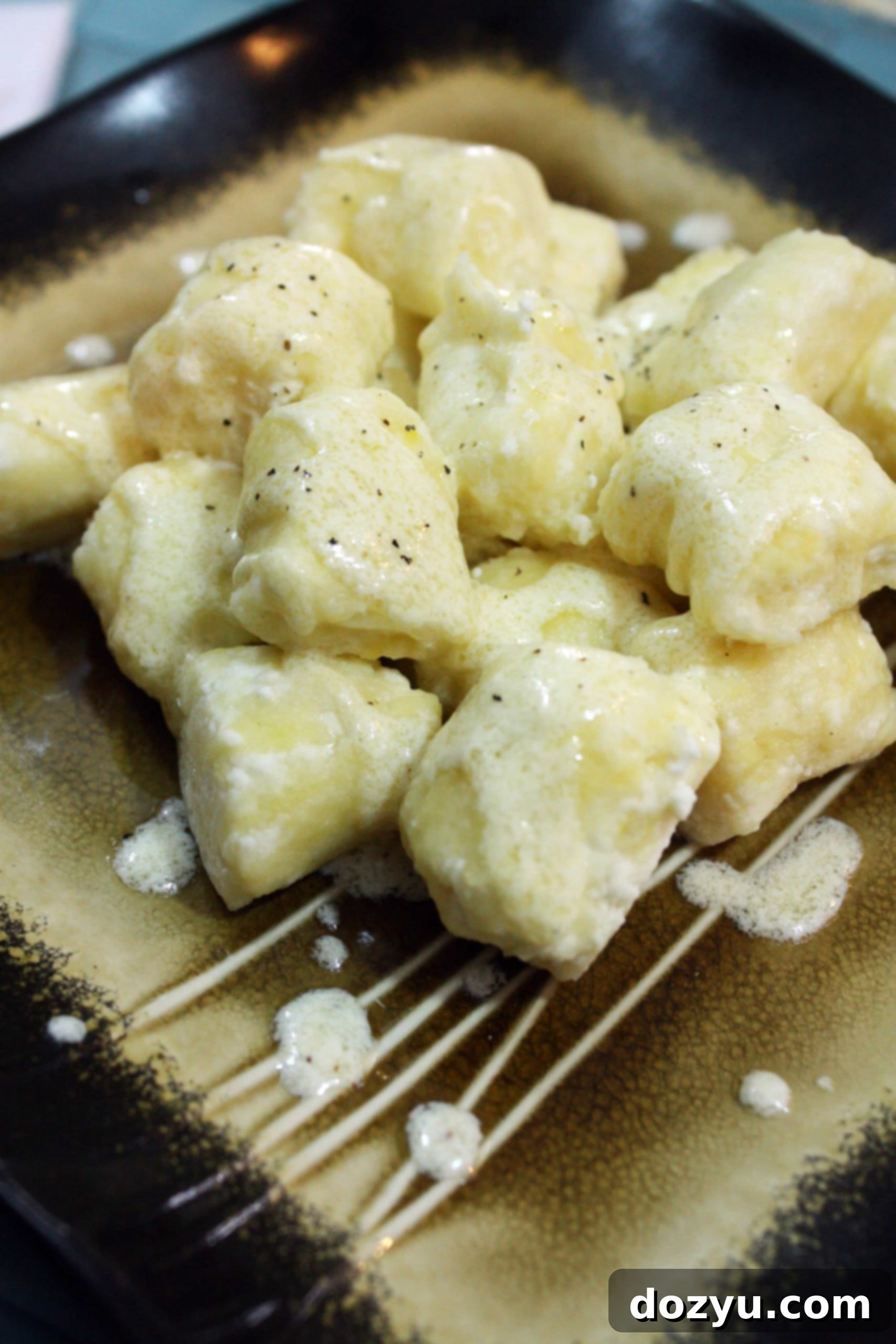 Ricotta Gnocchi with Marscarpone Parmesan Sauce in a serving bowl