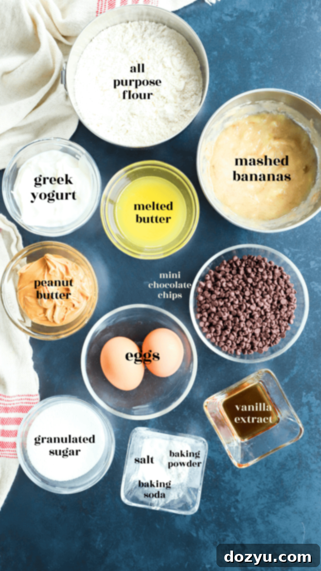 Perfectly Poppable Banana Peanut Butter Chocolate Muffins 4 Overhead flat lay shot of all the ingredients needed for banana mini muffins with text labels