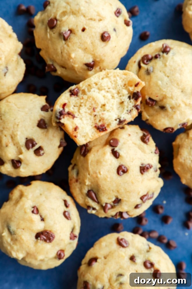 Perfectly Poppable Banana Peanut Butter Chocolate Muffins 7 A large pile of baked mini banana peanut butter chocolate chip muffins ready to be served
