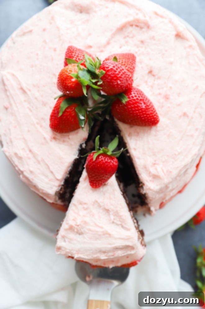 Luscious Chocolate Strawberry Cake 5 Cake slice being pulled out with cake knife image