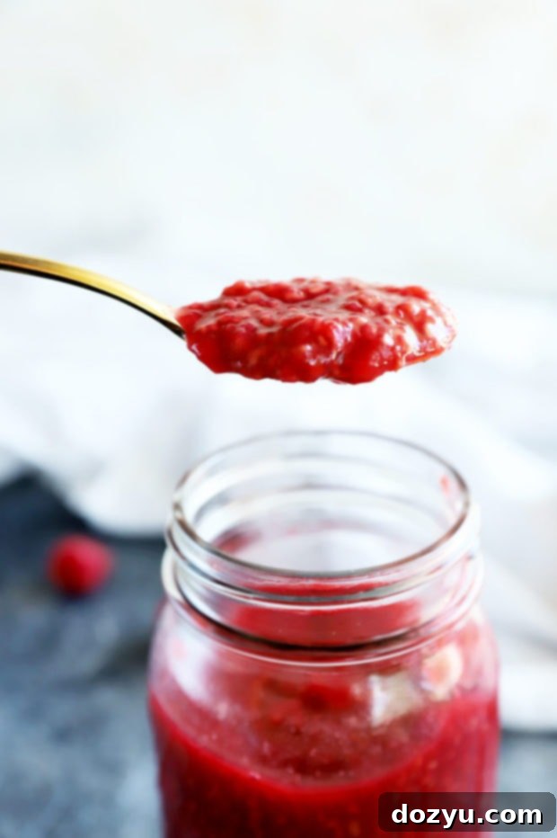 Ruby Raspberry Reduction 6 Spoonful of raspberry sauce on spoon
