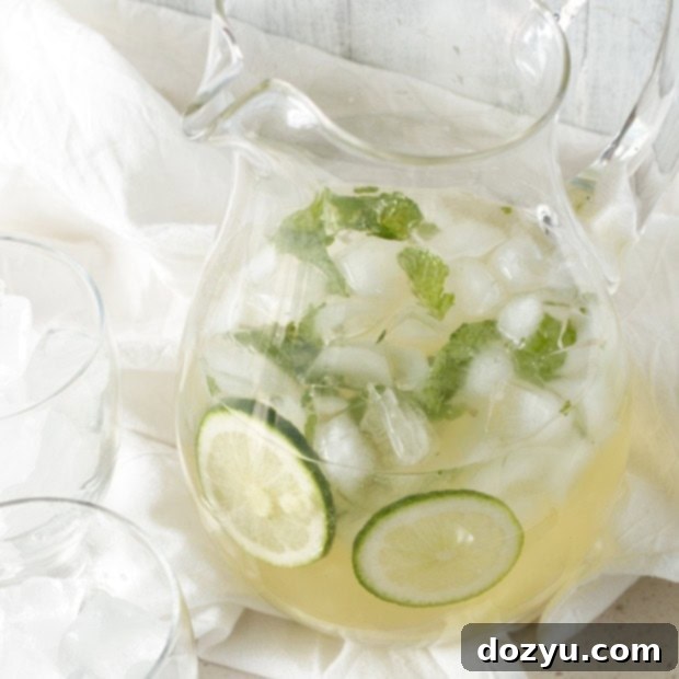 Ginger Mint Prosecco Punch 2 Ginger Mint Prosecco Punch in a glass with a lime slice and mint garnish