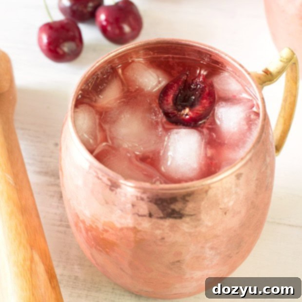 Vibrant Cherry Moscow Mule 2 Very Cherry Moscow Mule in a copper mug with fresh cherries and lime