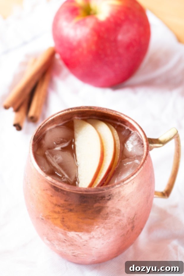 Autumn Orchard Mule 5 Cider Mule in a copper mug with fresh apples | cakenknife.com