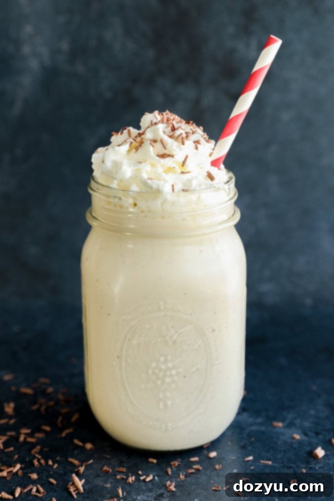 Baileys Coffee Cloud 2 baileys coffee milkshake in mason jar with whipped cream and chocolate shavings