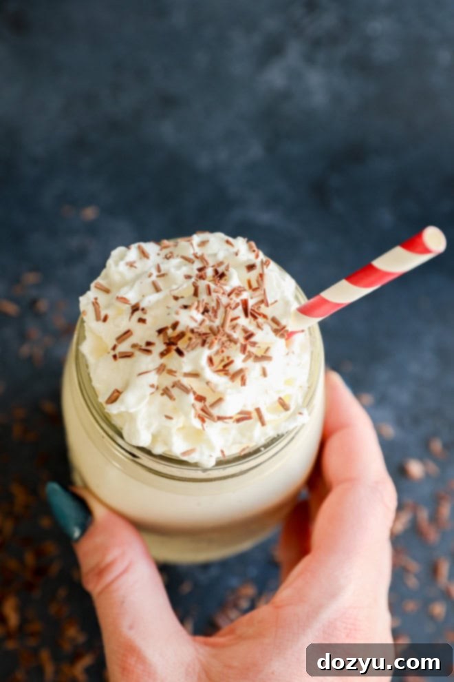 Baileys Coffee Cloud 5 hand holding mason jar with straw