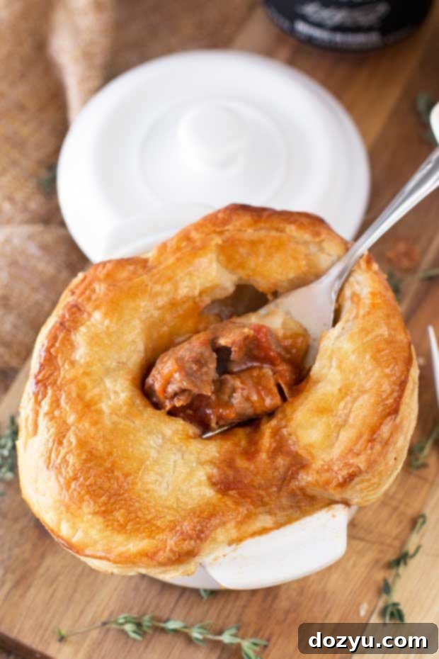 Individual Guinness Beef Stew Pot Pies ready to be baked to perfection