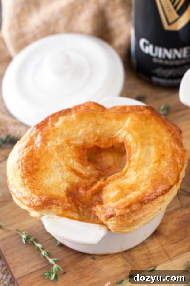 Close-up of a Guinness Beef Stew Pot Pie with a golden crust