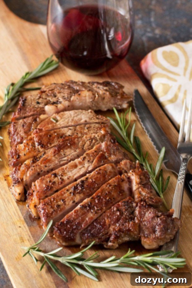 Ultimate Ribeye Perfection 6 The Perfect Ribeye Steak, showcasing a rich, dark crust and juicy interior, ready to be served.