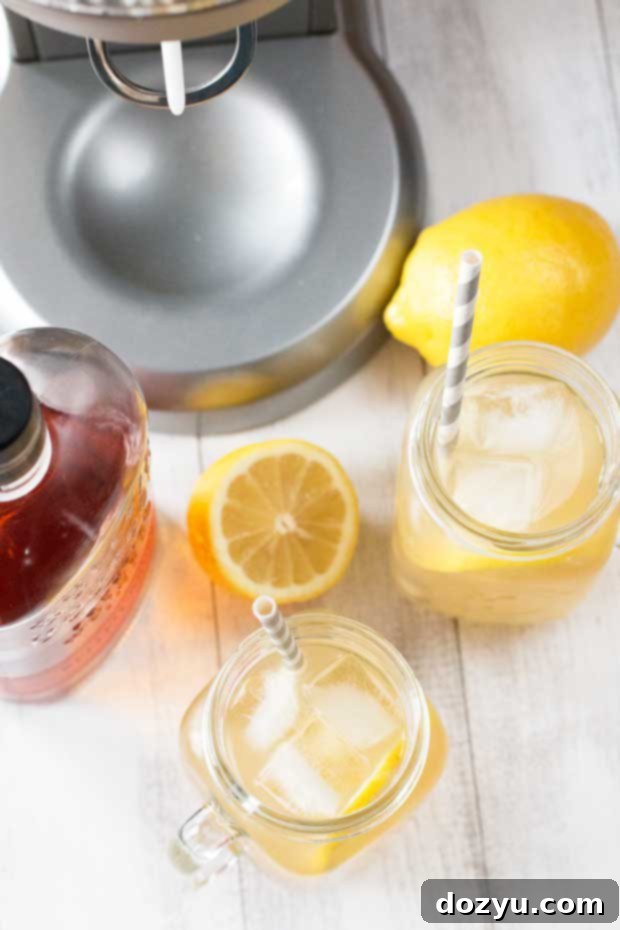 A vibrant Sparkling Bourbon Peach Lemonade in a glass, ready to be enjoyed, showcasing the perfect blend of peach, lemon, and bourbon