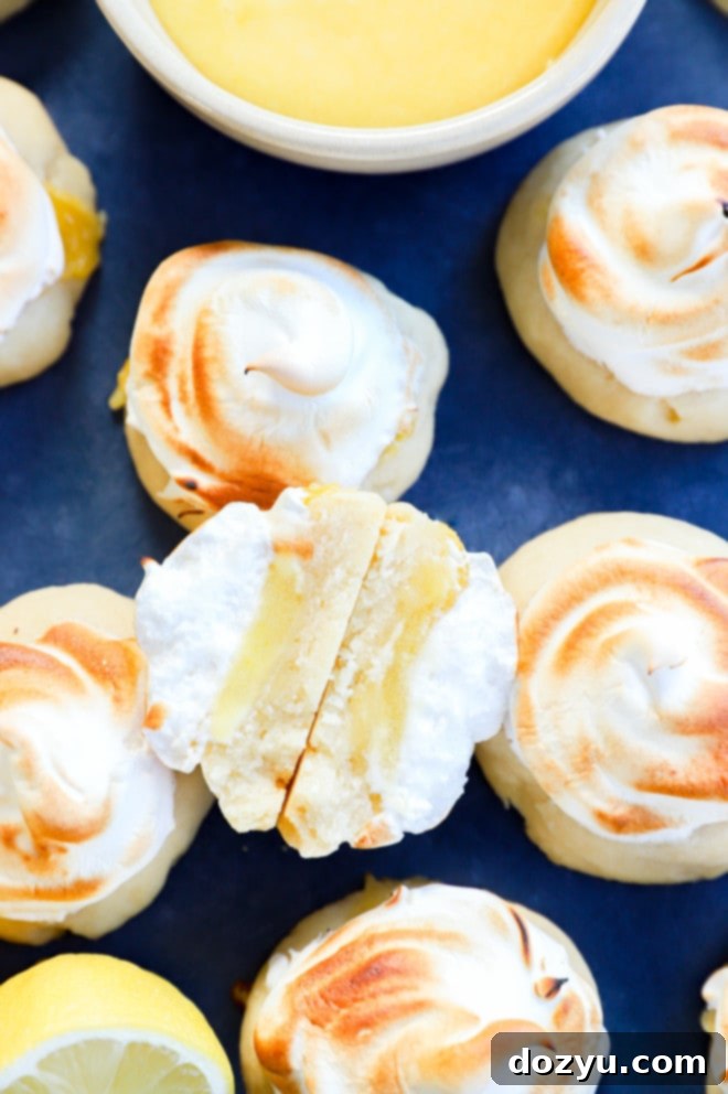 Lemon Curd Meringue Cookies 3 shortbread cookies with lemon curd and whipped meringue on top, ready to be enjoyed
