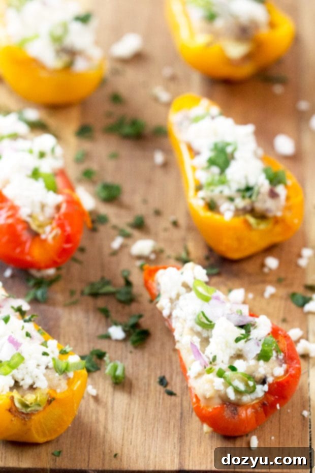 Greek Stuffed Roasted Sweet Peppers on a wooden board