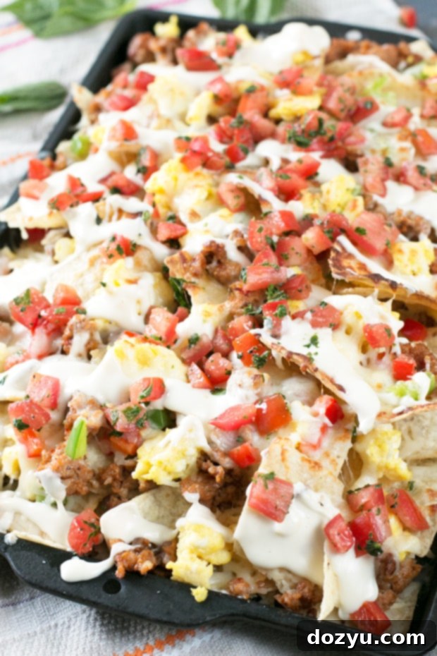 Delicious Breakfast Italian Nachos piled high with savory ingredients and cheese sauce