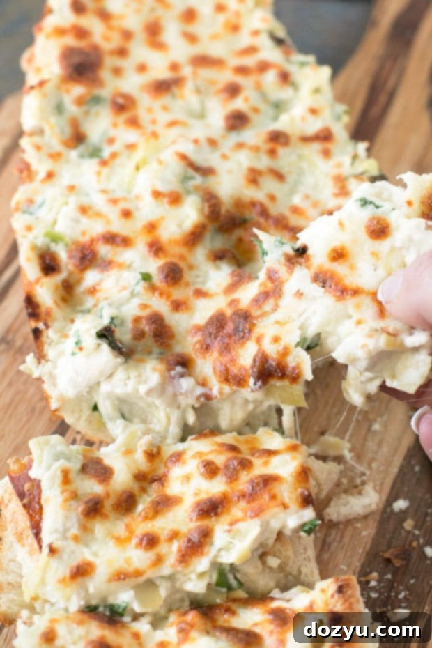 Chicken Spinach Artichoke Dip French Bread, freshly baked and ready to serve | cakenknife.com