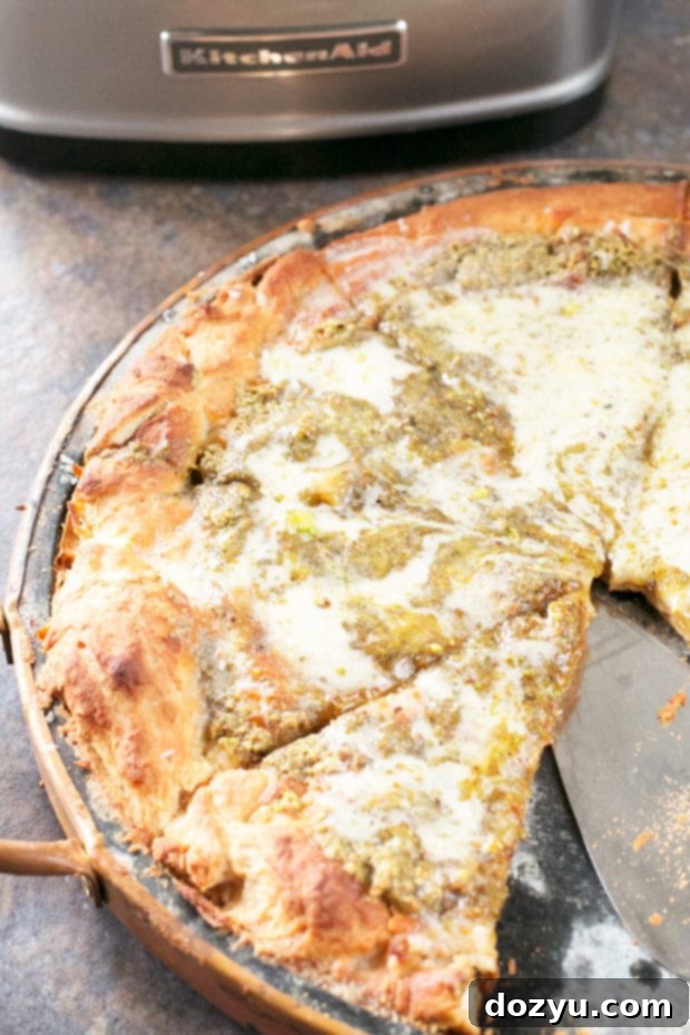 Close-up of KitchenAid Food Processor blending ingredients for pistachio pesto