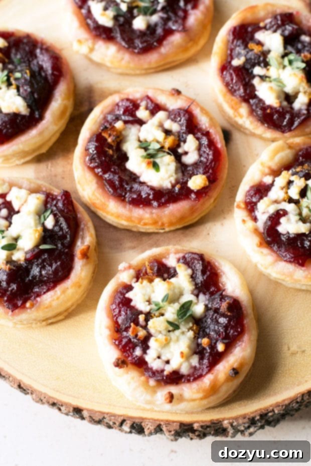 Sweet and Savory Cranberry Goat Cheese Tarts 4 Several individual Cranberry Goat Cheese Tarts cooling on a baking sheet