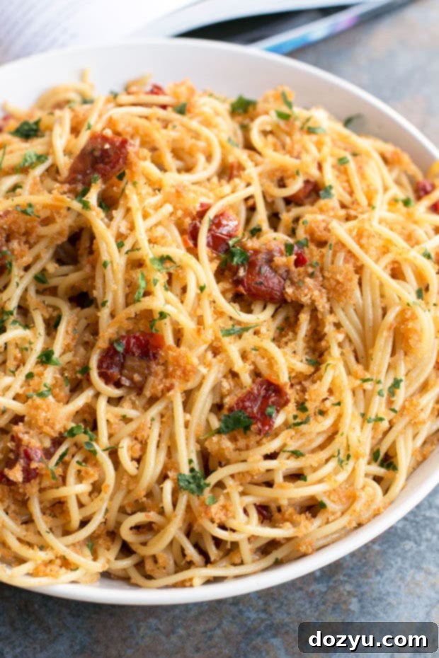 Reviewing Thug Kitchen 101 with Sun Dried Tomato Carbonara 4 A serving of Thug Kitchen 101's Sun-Dried Tomato Carbonara, ready to be enjoyed, highlighting the texture of the sauce and pasta.