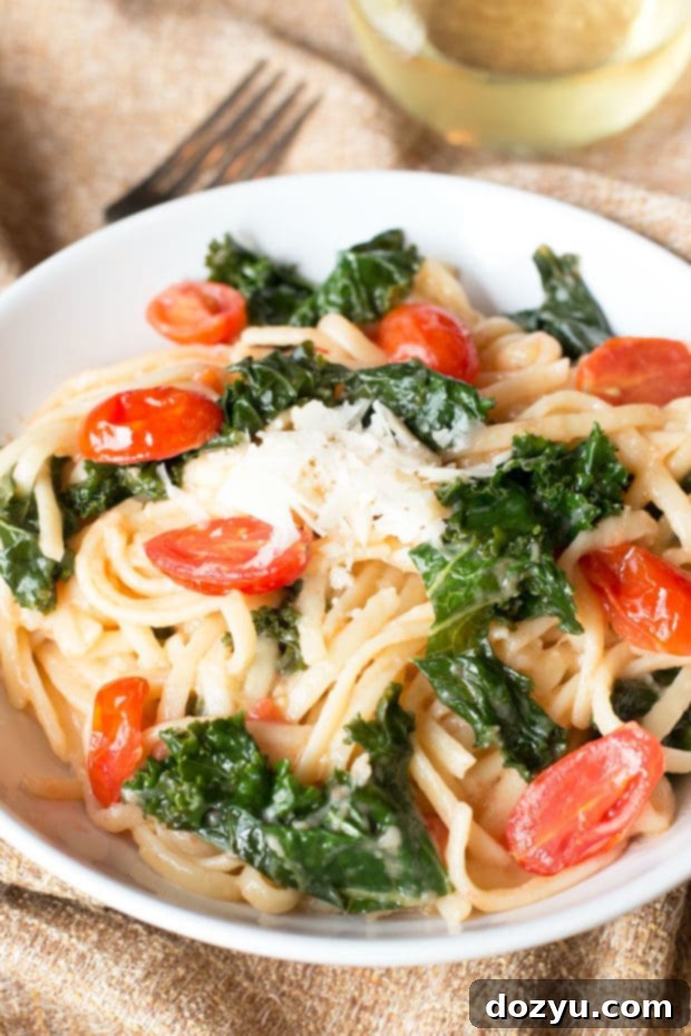A Modern Way to Cook Review Highlighting Kale Tomato Lemon One Pot Spaghetti 3 Close-up of the Kale, Tomato, and Lemon One-Pot Spaghetti in the pan, showing the rich, thick sauce coating the pasta.