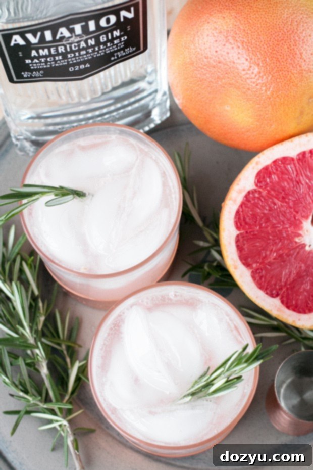 Verdant Blush Fizz 3 Rosemary Grapefruit Gin Fizz in a glass, a refreshing winter drink idea