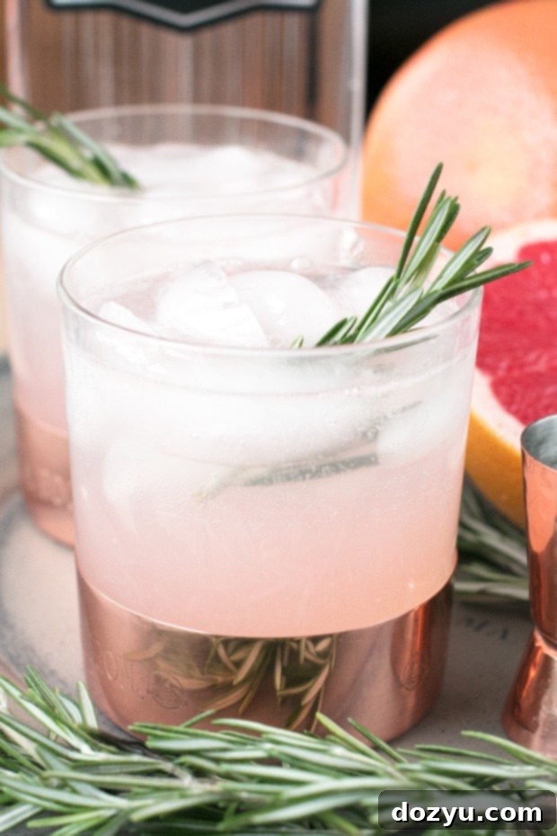 Verdant Blush Fizz 4 Close-up of a Rosemary Grapefruit Gin Fizz garnish