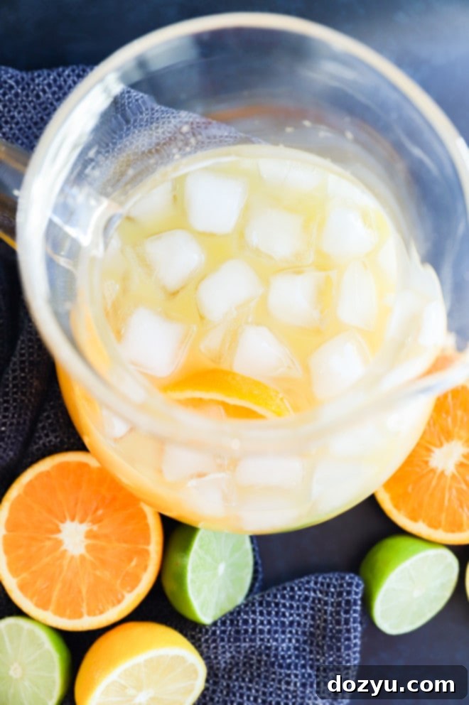 Spiced Rum Fiesta 4 making spiced rum punch in a pitcher