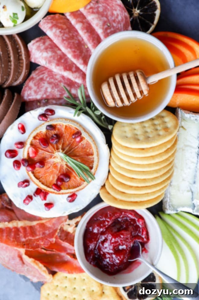 Yuletide Cheese Celebration 10 Brie, honey, cranberry jam, and crackers on a platter