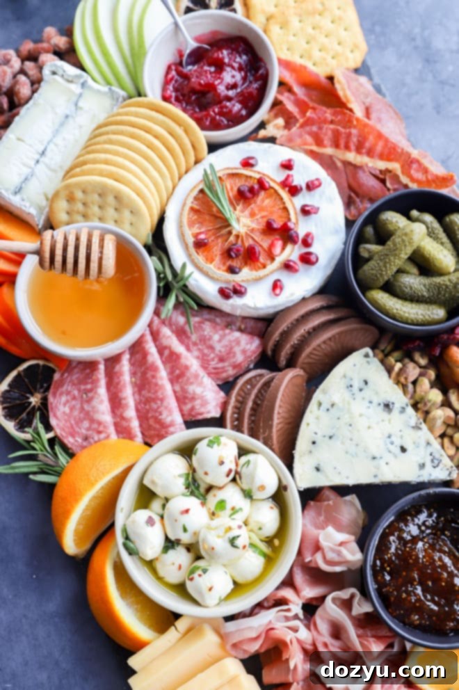 Festive Christmas Cheese Platter 11 Drizzling honey on a charcuterie platter
