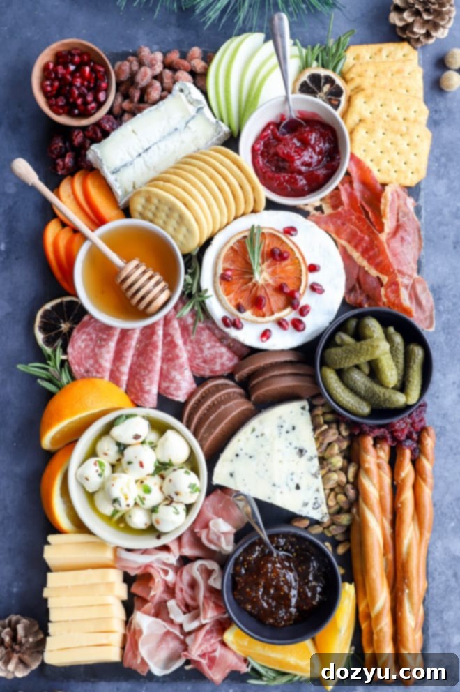 Yuletide Cheese Celebration 8 Assembled christmas cheese board on slate plate