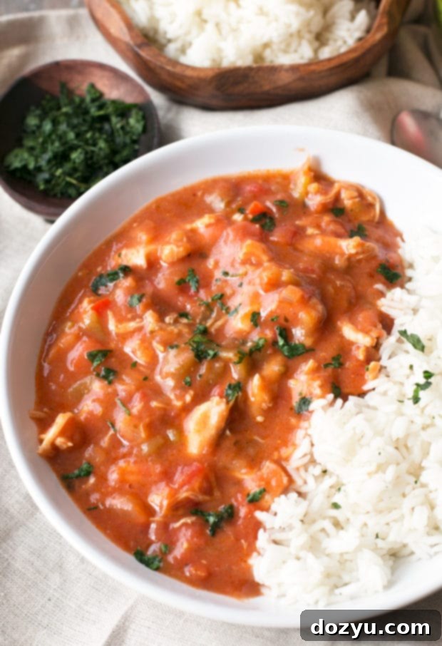 A large pot of simmering Hatch Green Chile Gumbo, showcasing its rich texture