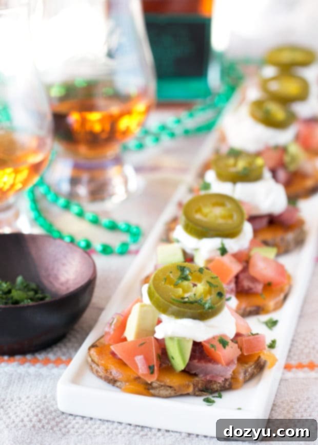 Delicious Irish Corned Beef Nacho Bites piled high with toppings | cakenknife.com #appetizer #party