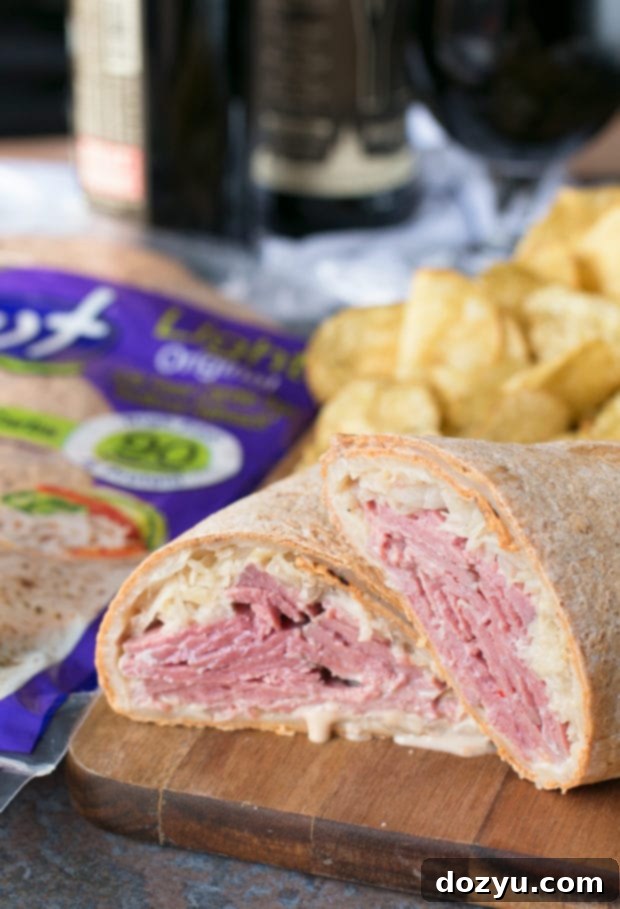 Close-up of a freshly made Irish Corned Beef Reuben Wrap, showcasing the filling and flatbread