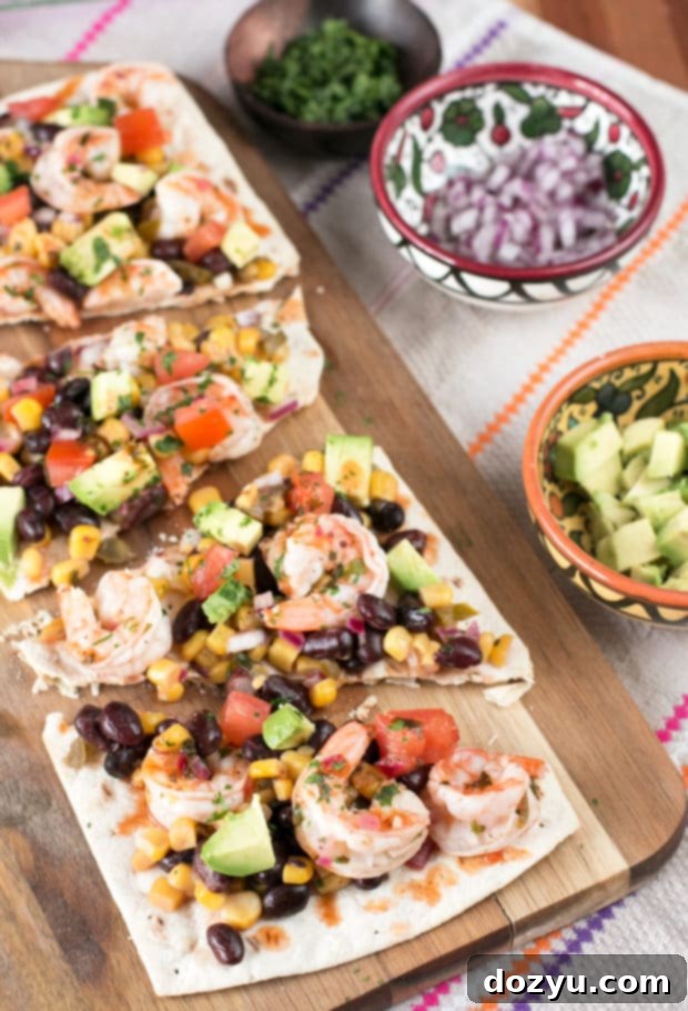 Zesty Southwestern Shrimp Flatbread 6 Overhead shot of a delicious Southwestern Shrimp Flatbread with all the toppings, ready to be enjoyed.