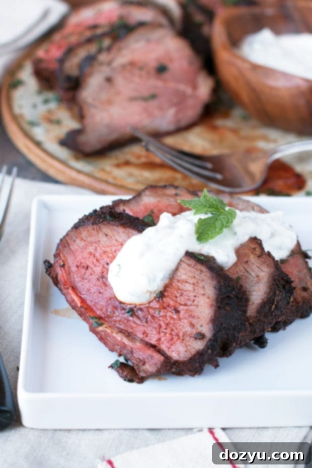 Ancho Chili Rubbed Leg of Lamb with Mint Yogurt Sauce - A perfect Easter dinner for a flavorful holiday spread.