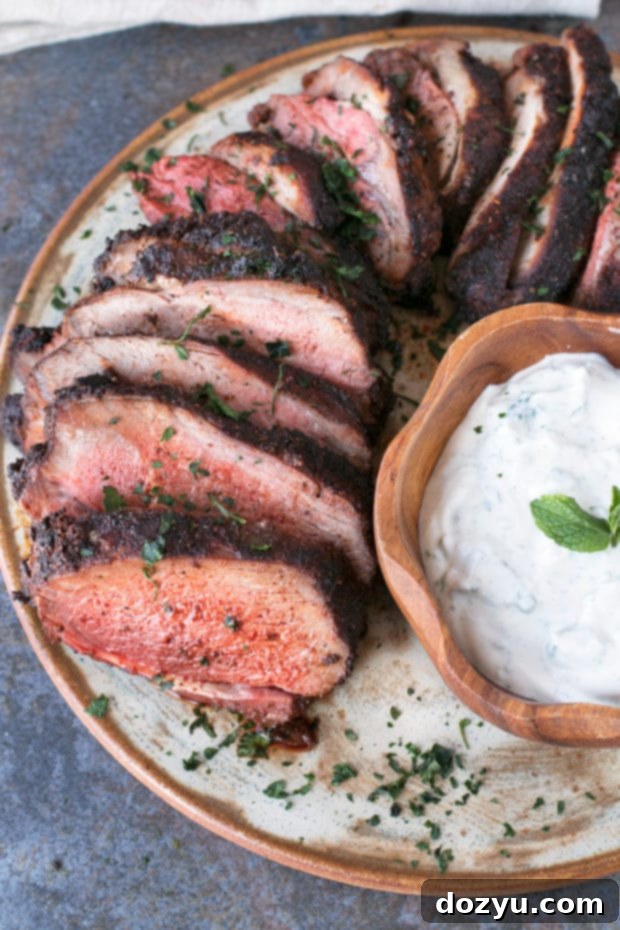 Spicy Ancho Chili Rubbed Leg of Lamb, a delicious and easy Easter dinner recipe with fresh mint yogurt sauce.