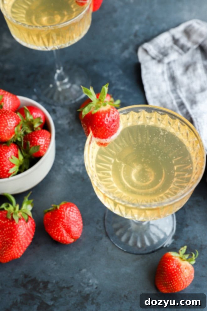 Strawberry Celebration Sparkle 7 sparkling wine cocktail with fresh berries in glasses