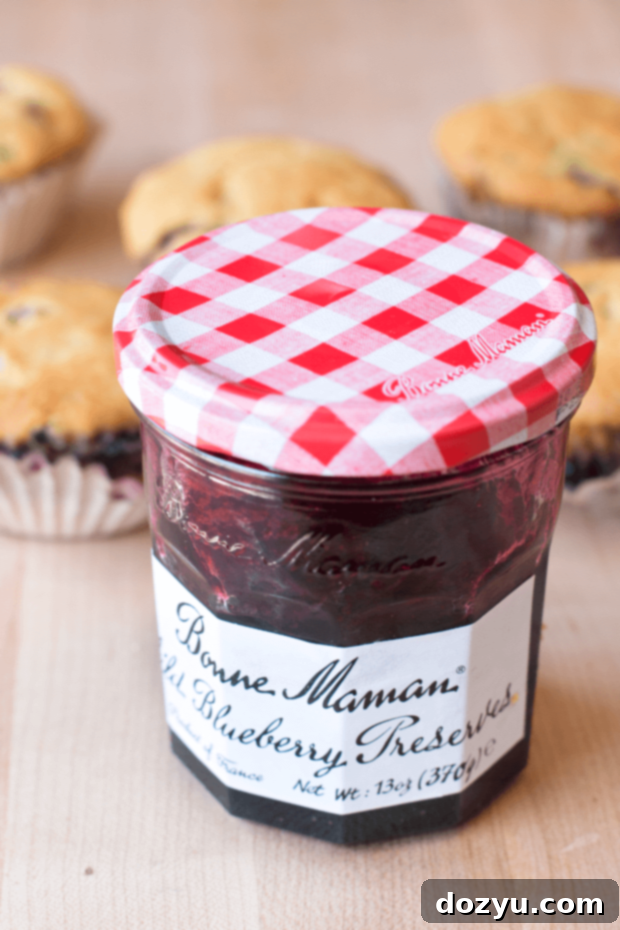 Another enticing view of the Blueberry Jalapeno Bacon Cornbread Muffins, showcasing their perfect bake. Image courtesy of cakenknife.com