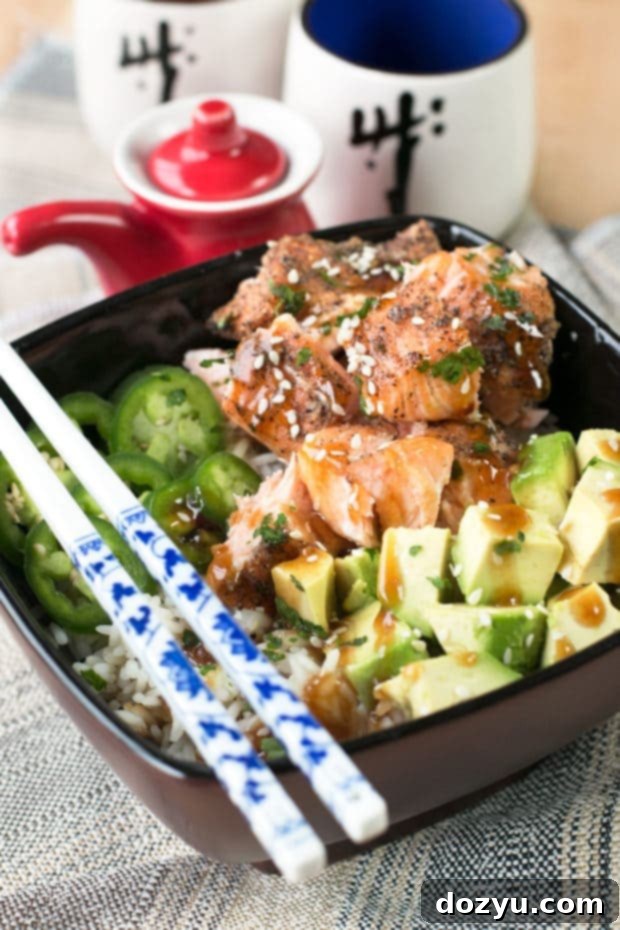 Sesame Salmon with Avocado Bowls 4 Close-up of a Sesame Salmon Avocado Bowl, highlighting the crispy salmon and fresh toppings.