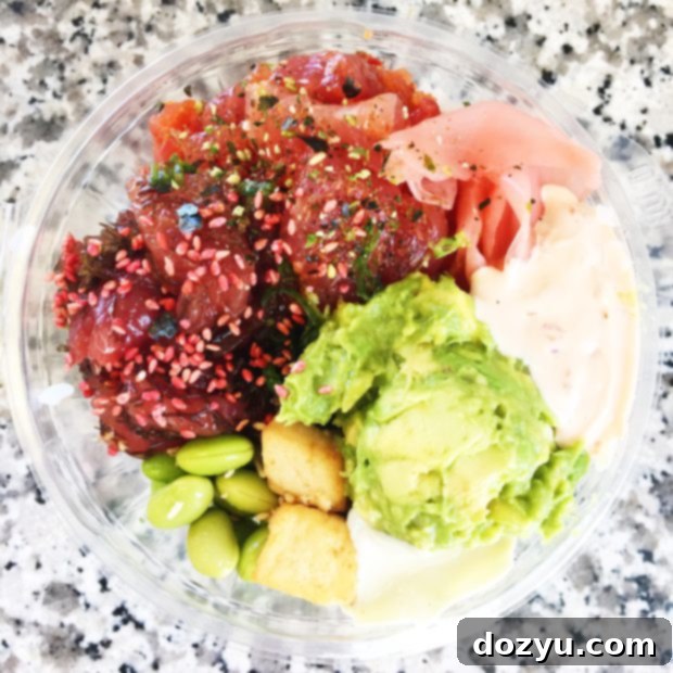 A colorful and fresh poke bowl from Fish Express on Kauai, showcasing various types of marinated raw fish, perfect for a Hawaiian lunch. Keywords: Fish Express Kauai, best poke, fresh Hawaiian food, Lihue restaurant.