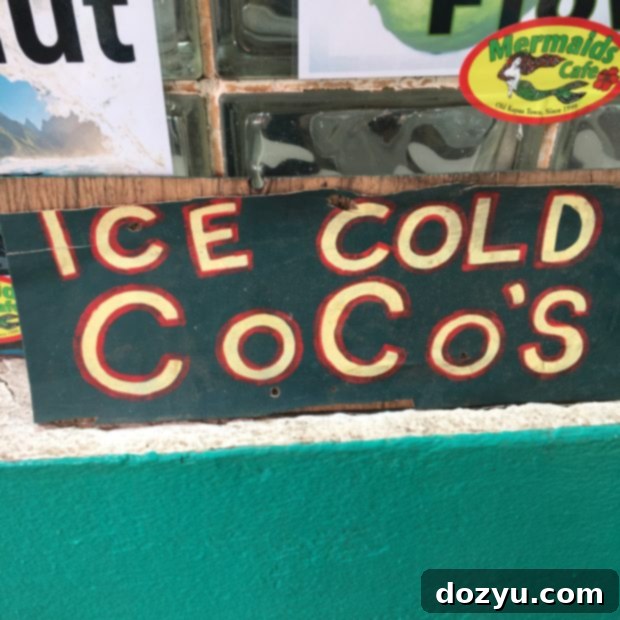 Colorful and inviting exterior of Mermaids Cafe in Kauai, showcasing vibrant murals and a casual, welcoming atmosphere. Keywords: Mermaids Cafe Kauai, Kapaa restaurants, colorful cafe, Hawaiian tacos.