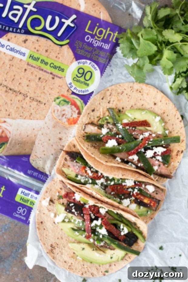 Close-up of marinated flank steak on a cutting board, ready for grilling.