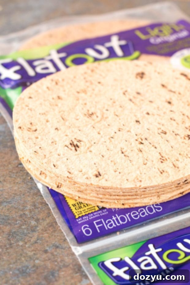 Flatout Flatbreads cut into circles and ready to be warmed on the grill for tacos.