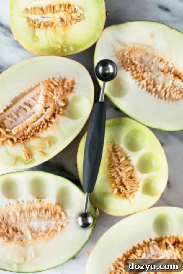 Pitcher of Melon Sangria with glasses and melon balls