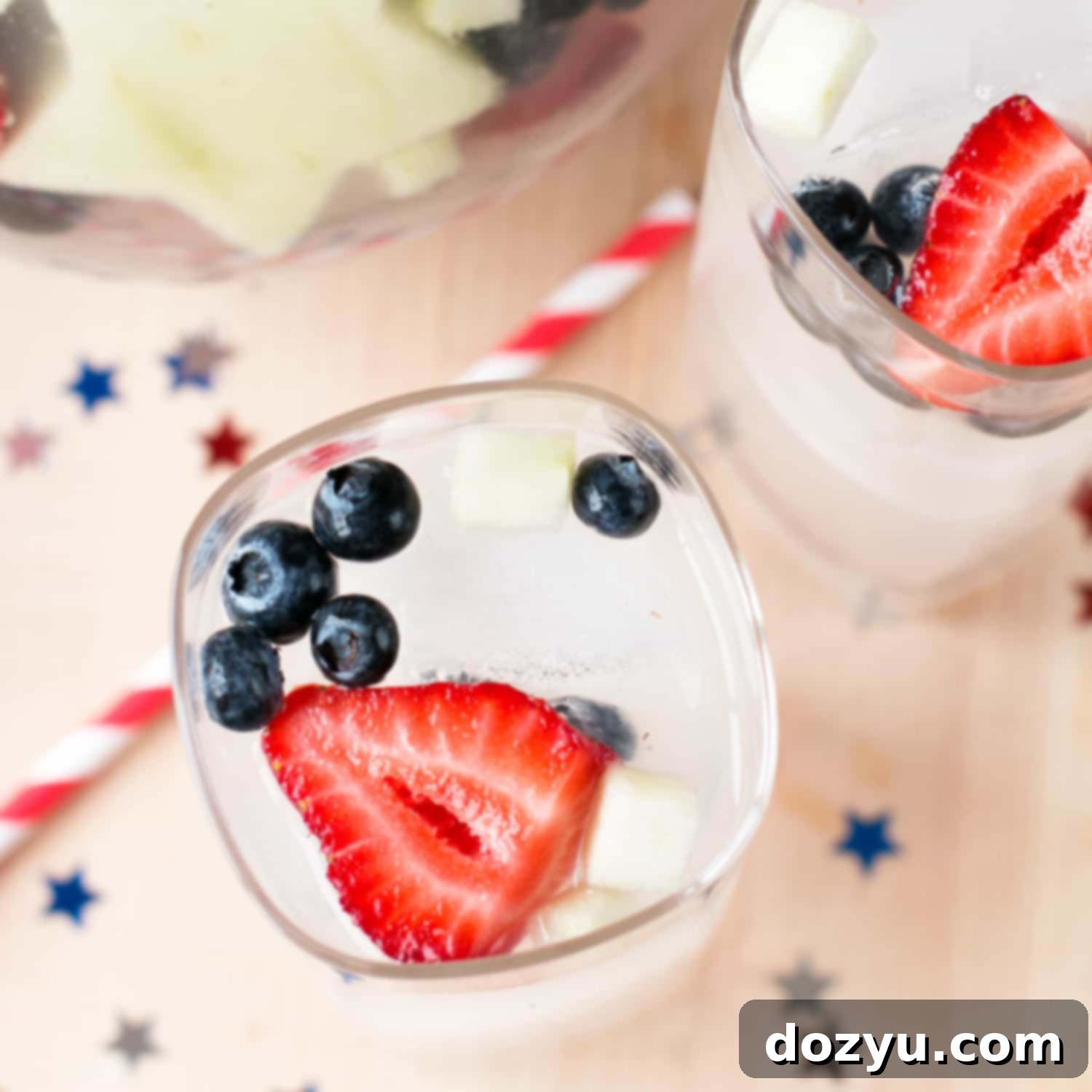 Americana Tom Collins Punch 7 Patriotic Tom Collins Punch with berries and apple stars