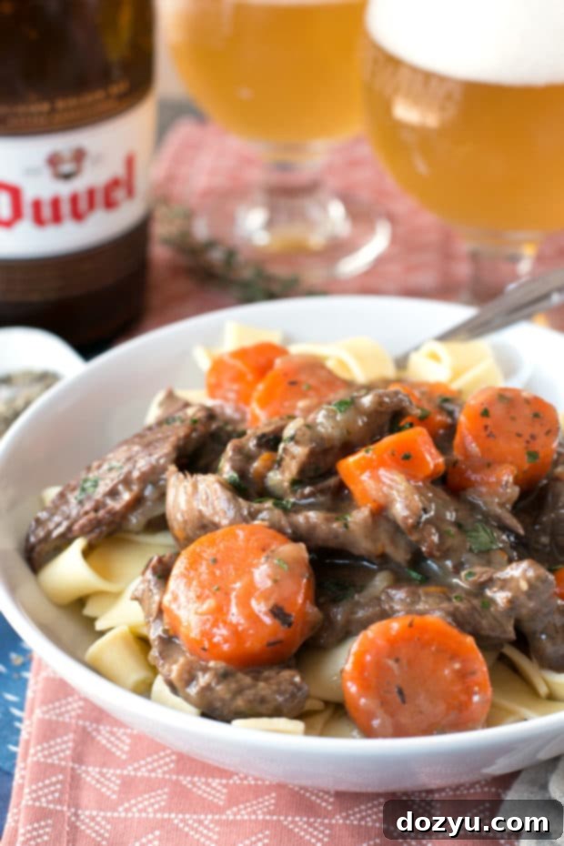 Carbonnades à la Flamande (Belgian Beer Beef Stew) | Sizzling beef browning in a large cast-iron skillet, building flavor for the stew.