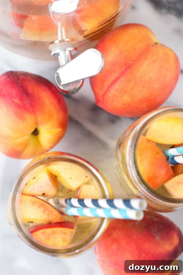 Effervescent Grilled Peach Sangria 2 Sparkling Grilled Peach Sangria, a perfect summer grilling recipe with peaches and white wine, a refreshing cocktail from cakenknife.com