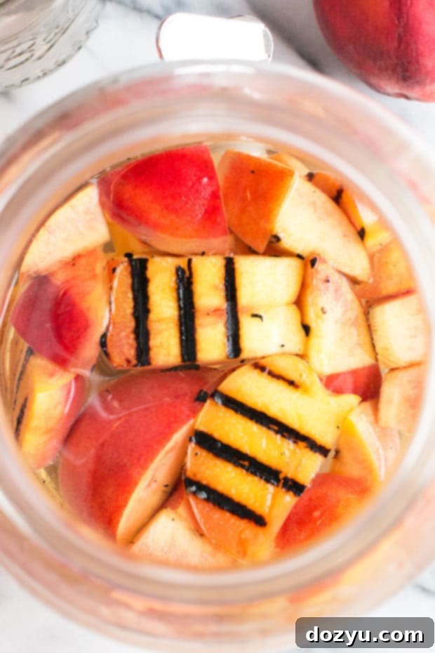 Effervescent Grilled Peach Sangria 3 Delicious Sparkling Grilled Peach Sangria, a refreshing summer cocktail with sweet grilled peaches and white wine