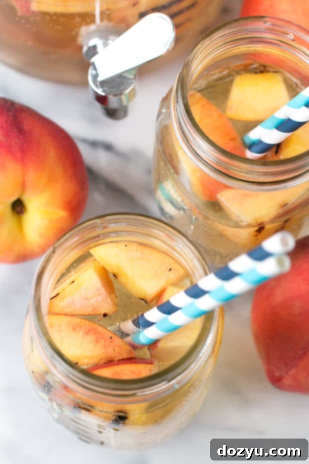 Effervescent Grilled Peach Sangria 6 Sparkling Grilled Peach Sangria served in glasses, ready for a refreshing summer drink experience