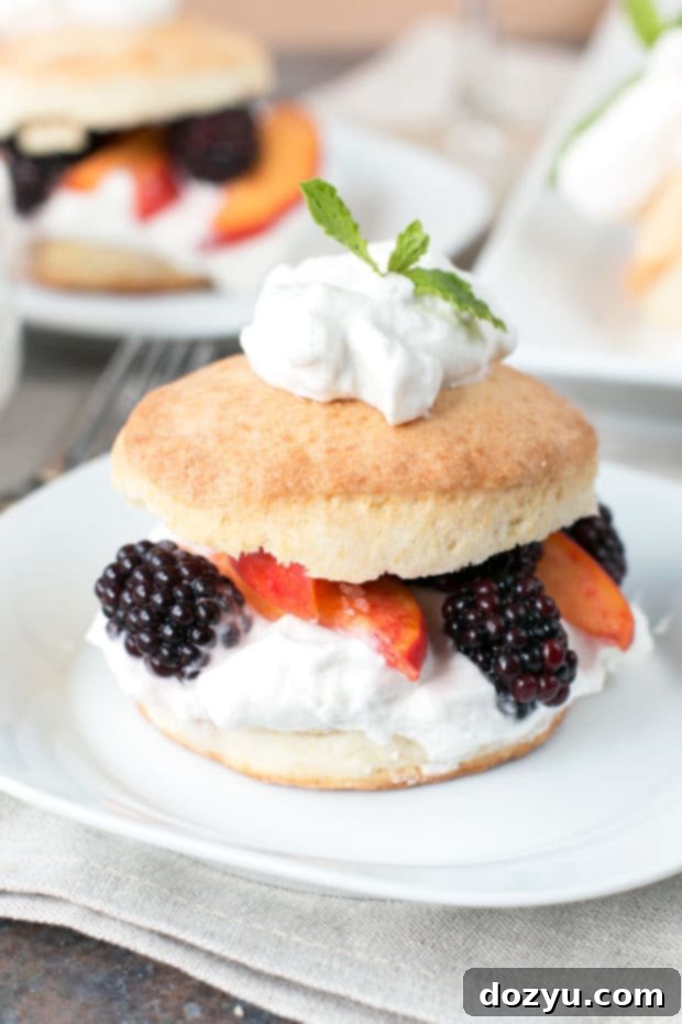 Close-up of fresh peaches and blackberries, key ingredients for a vibrant shortcake dessert.