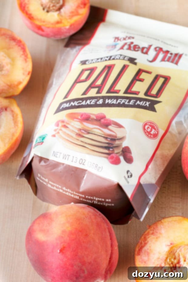 Golden Peach Pancakes with Whipped Mint Butter 6 Serving of warm peach pancakes, garnished with fresh mint leaves and a generous drizzle of maple syrup, capturing the essence of a perfect summer breakfast or brunch.
