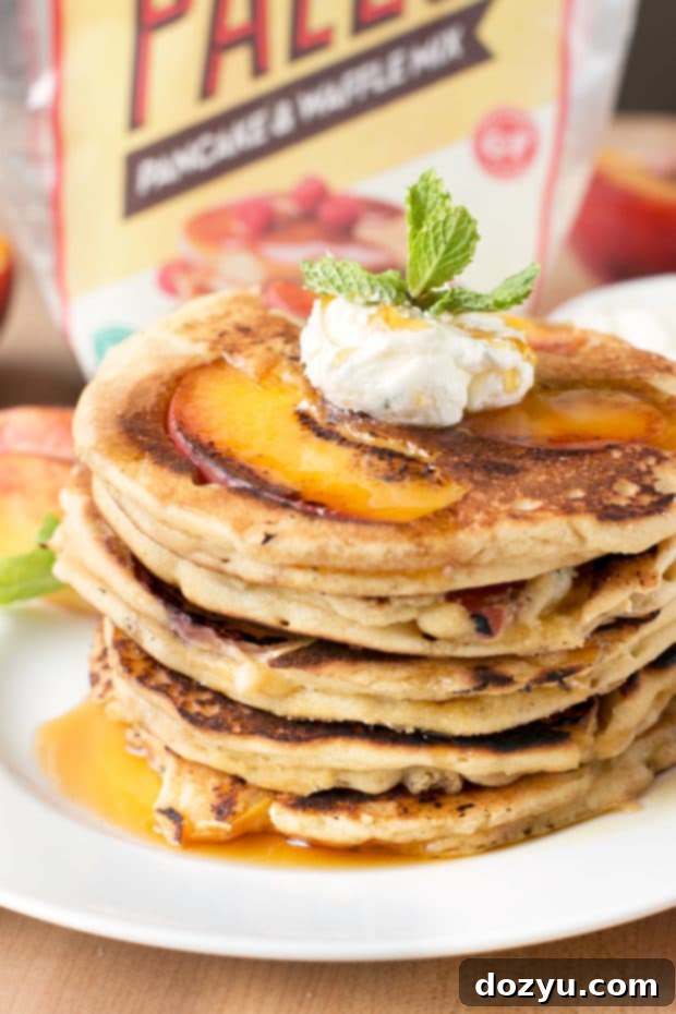 Golden Peach Pancakes with Whipped Mint Butter 7 Rustic setting of peach pancakes with optional whipped mint butter and bourbon maple syrup, showcasing the fresh, healthy, and indulgent aspects of the recipe for diverse palates.